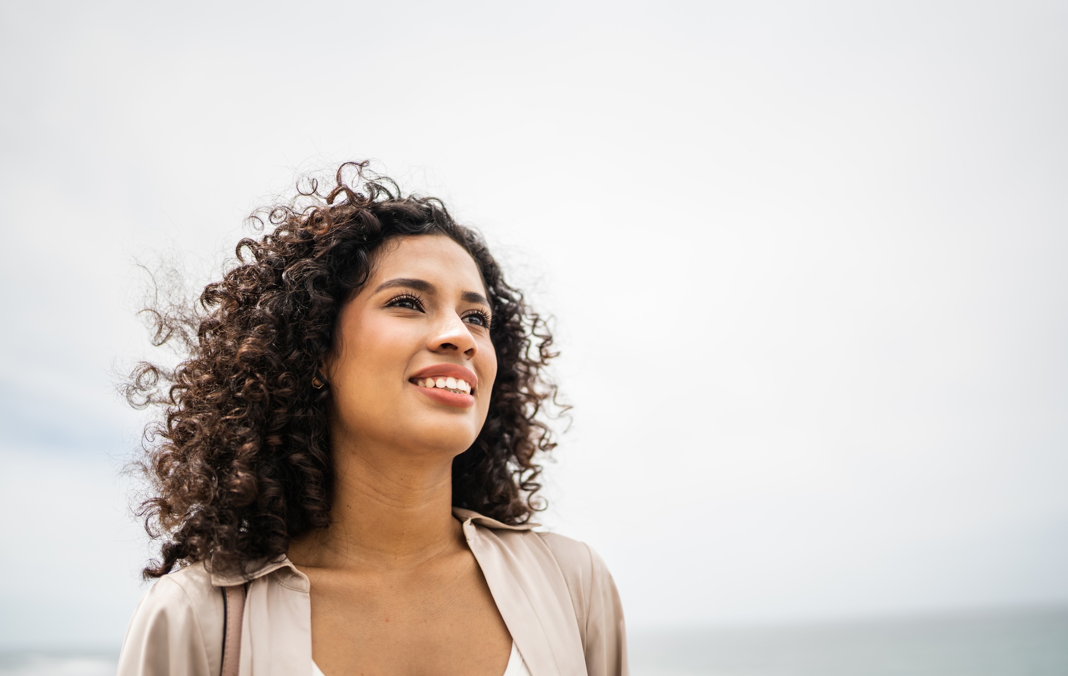 Woman looking up hopefully